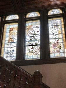 Antique Stained Glass Brightens the Grand Staircase of Castle La Crosse